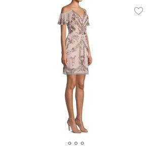 Brand new dress sleeves can also be worn off the shoulders . Blush color